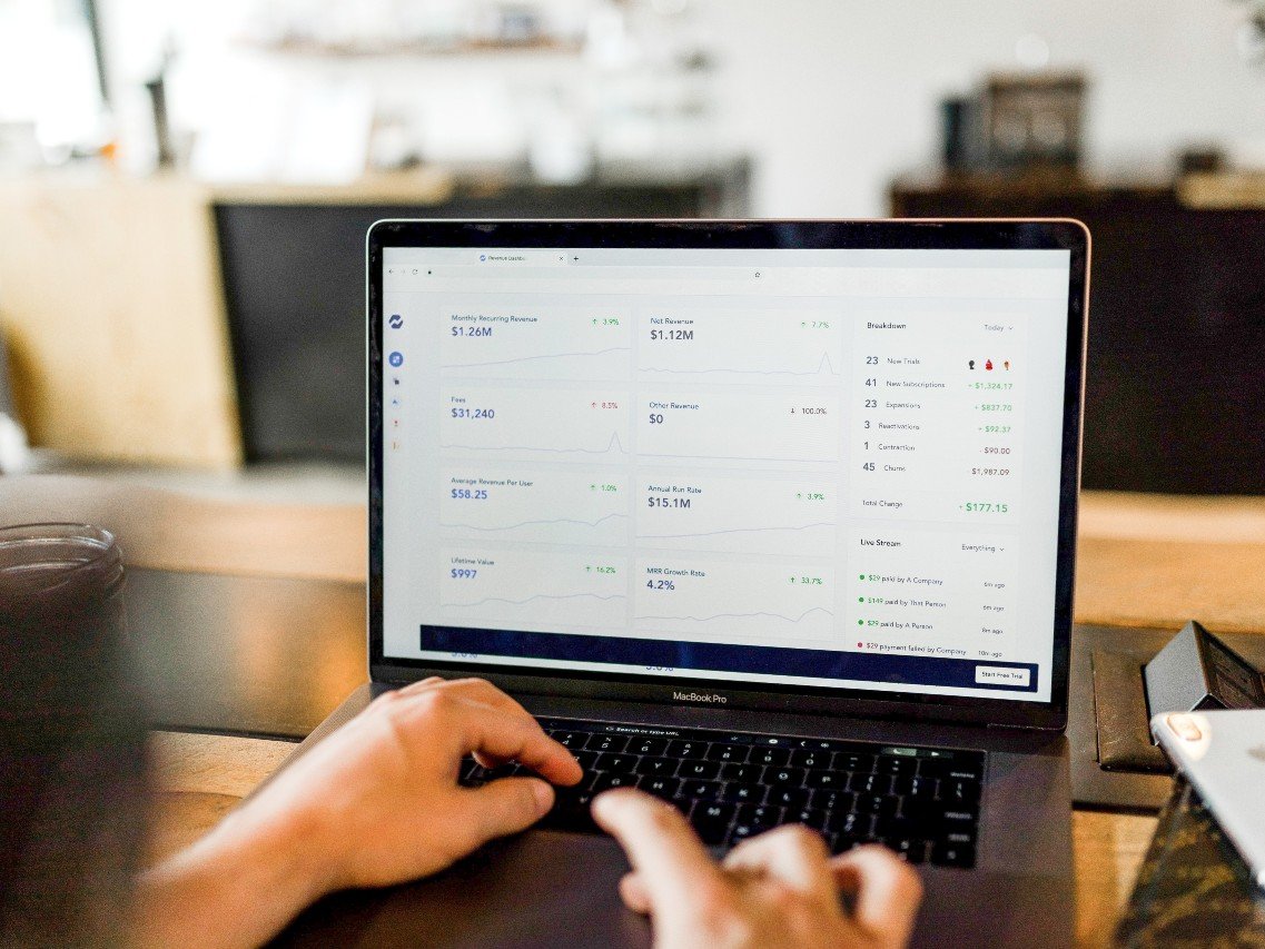 A person reviewing a loan pipeline dashboard on a laptop