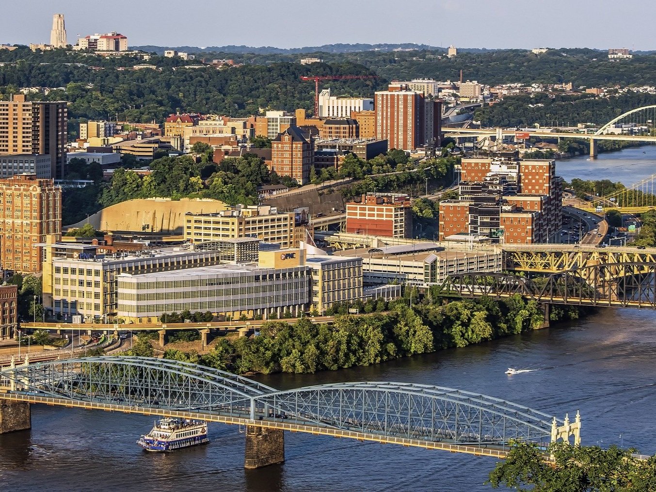 (Image) Riverfront office buildings and steel bridges in a Rust Belt city